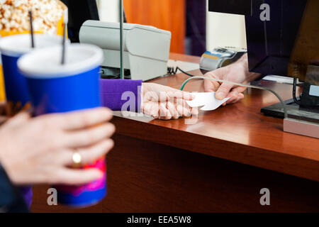 Women Buying Movie Tickets At Box Office Stock Photo