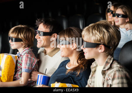 Happy Families Watching 3D Movie In Theater Stock Photo