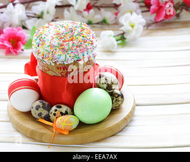 Easter cake with glace icing and colored easter eggs rustic style Stock Photo