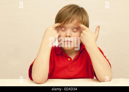 young boy making faces Stock Photo