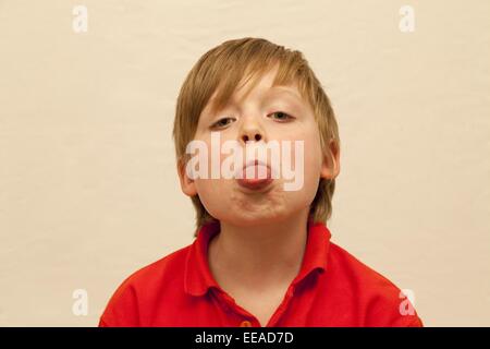 young boy sticking his tongue out Stock Photo