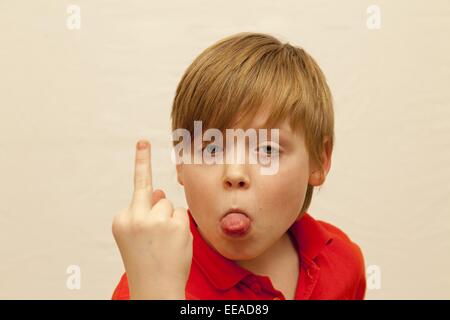 young boy giving the finger Stock Photo