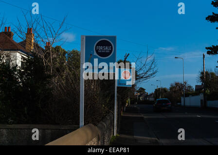 Estate Agents signs in a suburban street Stock Photo