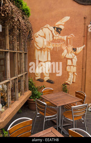 UK, London, Twickenham, Church Street, jester mural outside cafe Stock Photo