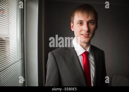 Hands of wedding groom getting  ready in suit Stock Photo