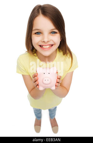 beautiful little girl with piggy bank Stock Photo