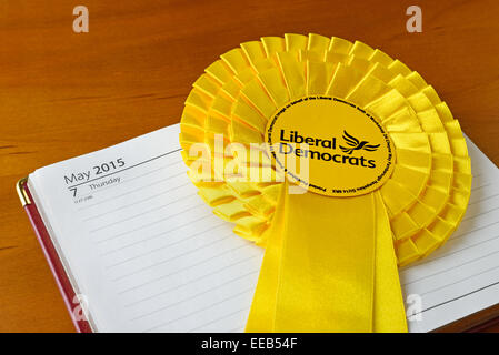 Close up of a Liberal Democrat election 2015 rosette on a diary open at election date Stock Photo