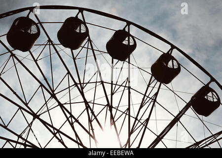 aged and worn  vintage photo of ferris wheel Stock Photo