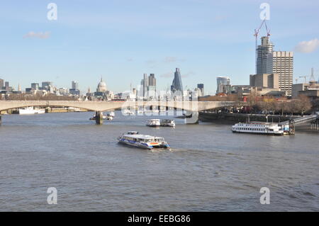 River boats on Thames with city of London, including St Pauls Cathedral, 122 Leadenhall (aka Cheesegrater), Waterloo Bridge Stock Photo