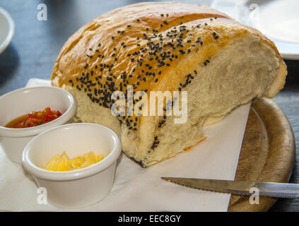 Homemade Bread loaf ,Spicy spread in ramekin - appetizer, breakfast or snack Stock Photo