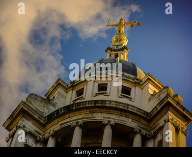 LADY JUSTICE  BRONZE STATUE HOLDING A SWORD AND THE SCALES OF JUSTICE ,OLD BAILEY, THE CENTRAL CRIMINAL COURT,LONDON,ENGLAND. Stock Photo