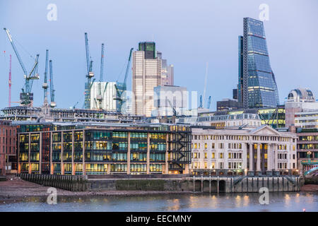 Tower 42, the Cheesegrater and New Court, City of London with tower cranes on the site of the new Bloomberg building in EC4 Stock Photo