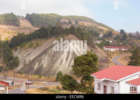 BULEMBU, SWAZILAND, AFRICA - Former asbestos mining town, now largely unoccupied, with mound of tailings. Stock Photo