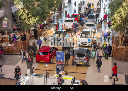 SOWETO, JOHANNESBURG, SOUTH AFRICA - New cars and shoppers at the Maponya Mall shopping center. Stock Photo