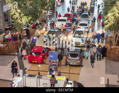 SOWETO, JOHANNESBURG, SOUTH AFRICA - New cars and shoppers at the Maponya Mall shopping center. Stock Photo