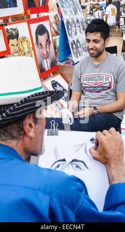 Piazza Navona, artist is sketching for visitors, Rome Italy Stock Photo