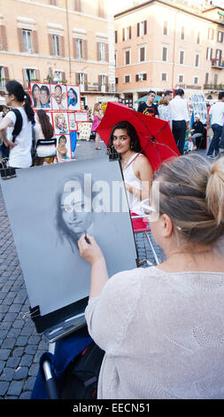 Piazza Navona, artist is sketching for visitors, Rome Italy Stock Photo