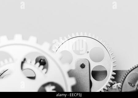 A group of silver gears functioning together in a precision machinery Stock Photo