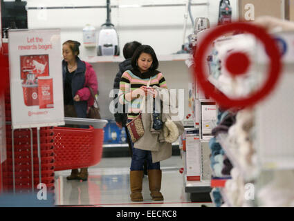 Vancouver, Canada. 15th Jan, 2015. Residents shop inside a Target store in Richmond, Canada, Jan. 15, 2015. Target will discontinue operating stores in Canada, a market that it entered only two years ago. The US-based retail company will close down all 133 locations across Canada and 17,600 employees will be affected. © Liang Sen/Xinhua/Alamy Live News Stock Photo