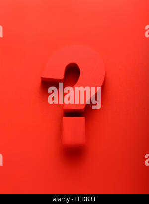 Red question mark on a red background Stock Photo