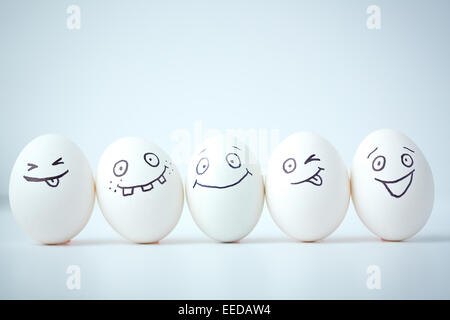 Line of eggs with different facial expressions Stock Photo