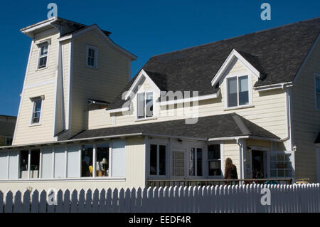 Elegant Californian coastal architecture wooden mill tower & millers white cottage & picket fence Mendocino Stock Photo