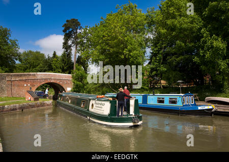 UK, England, Wiltshire, Pewsey Wharf, narrowboat passing under bridge on Kennett and Avon Canal Stock Photo