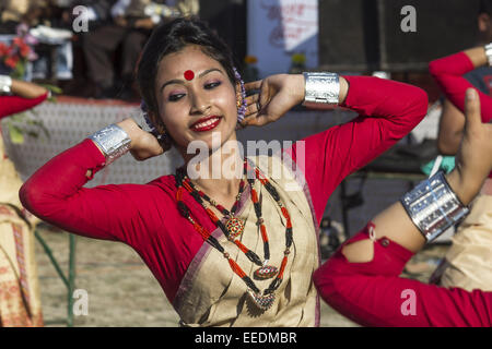 Sivasagar, Assam, India. 16th Jan, 2015. Indian girls in traditional attire perform a Bihu Dance during Bhogali Bihu celebrations in Sivasagar district of northeastern Assam state on January 16, 2015. The festival marks the end of the winter harvesting and is celebrated on the first day of 'Magh' month of Assamese calendar. Credit:  Luit Chaliha/ZUMA Wire/ZUMAPRESS.com/Alamy Live News Stock Photo