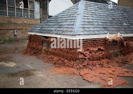 A Pound of Flesh for 50p, also known as Melting House, is a temporary outdoor sculpture by artist Alex Chinneck, located in London, UK. Part of the city's Merge Festival, the two-story house sculpture was constructed from 8,000 paraffin wax bricks and is designed to melt with assistance from a heating apparatus. Stock Photo