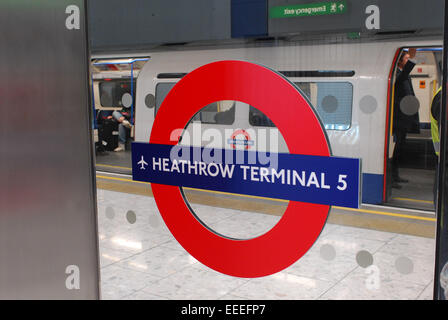 Station roundel at Heathrow Terminal 5 Underground station Stock Photo