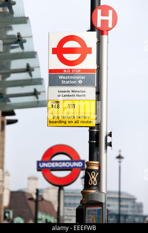 Close up of bus and tube signage outside Westminster station Stock Photo