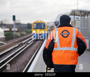 Station staff on the platform at Clapham High Street Overground station Stock Photo