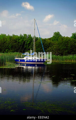 Moored Yacht Pleasure Craft Sailing Boat on a Lough Derg Lake in Tipperary Ireland Stock Photo