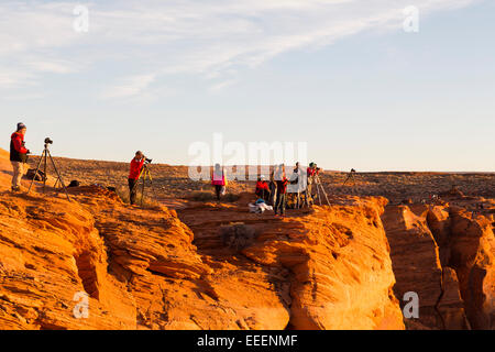 PAGE, AZ Photographers in position as the sun goes down at Horseshoe Bend. Stock Photo