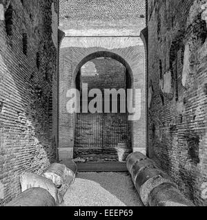 A close up view of the impressive ancient roman colosseum arches situated in the Italien capital of Rome. Stock Photo