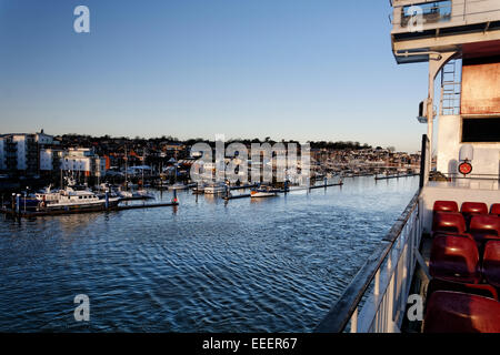 The RedJet passenger ferry terminal seen from the Red Funnel car ferry at Cowes, Isle of Wight in morning sunshine Stock Photo