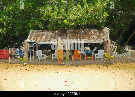 Beach side palapa shack with surfboards and kayaks for rent on St. Croix, US Virgin Islands, Caribbean. Stock Photo