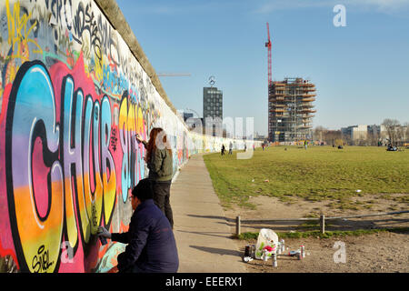 Berlin, Germany, sprayer at the back of the East Side Gallery Stock Photo