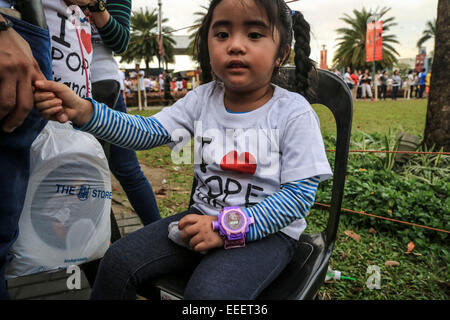 Manila, Philippines. 16th Jan, 2015. People gathered to see the Pope Francis reaching to the Mall of Asia to hold general mass and preach about corruption and inequality in the country. © Guillaume Payen/ZUMA Wire/ZUMAPRESS.com/Alamy Live News Stock Photo