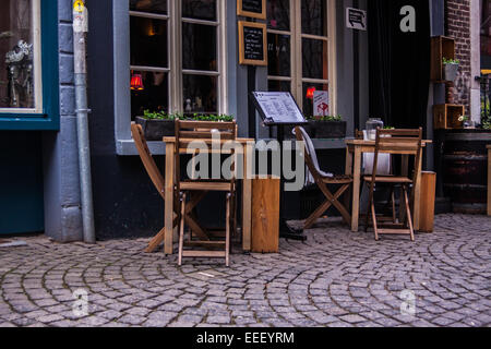 Table and chairs near a bar on the streets of Maastricht, Limburg, The Netherlands Stock Photo