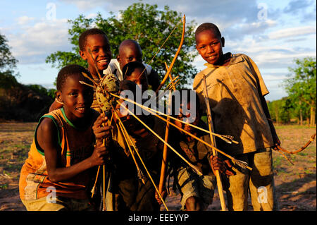 TANZANIA, Kondoa, children of Sandawe a hunter tribe play with bow and arrow Stock Photo