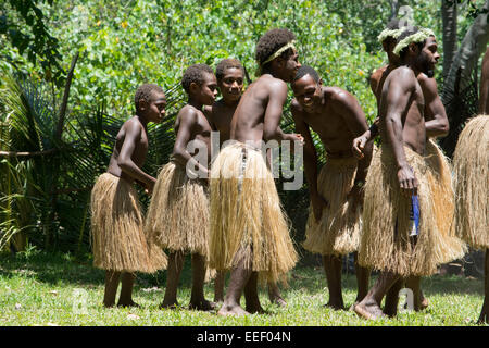 Melanesia, Vanuatu, Tanna Island. Traditional village welcome dance. Men in long grass skirts. Stock Photo