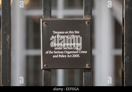 A sign reads 'Trespass on this site is a criminal offence' on the fence surrounding Portcullis House, Westminster, London Stock Photo