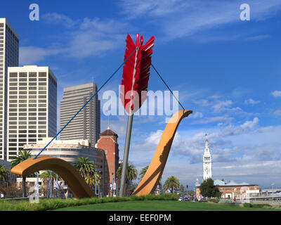 Cupid's Span a giant bow and arrow sculpture on the Embarcadero with the Ferry Building behind San Francisco California USA Stock Photo