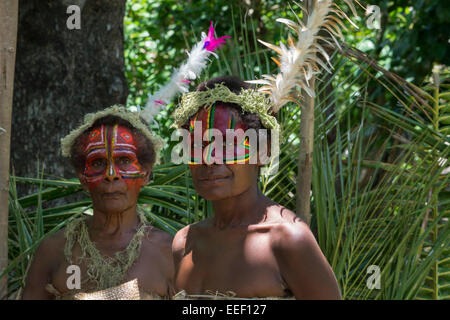 Melanesia, Vanuatu, Tanna Island. Traditional welcome ceremony, villagers with brightly painted faces. Stock Photo