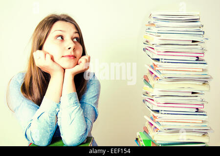 Young student have a lot of work to do. Education conceptual image.