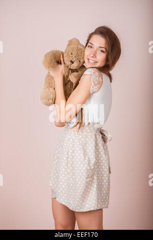 Girl and teddy bear Stock Photo