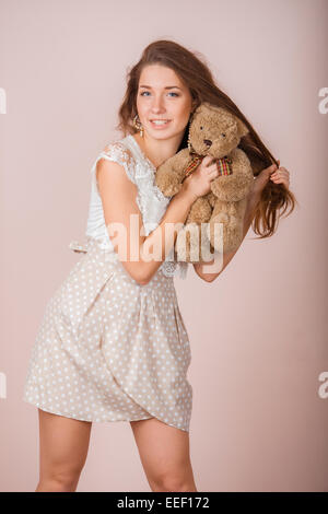 Girl and teddy bear Stock Photo