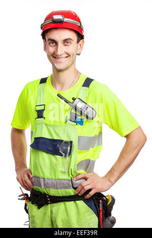 Young handsome contractor in light green uniform. Isolated over white background Stock Photo