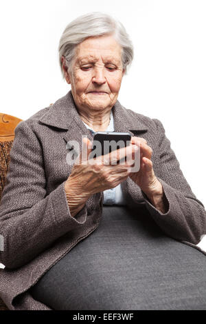 Senior woman using mobile phone Stock Photo
